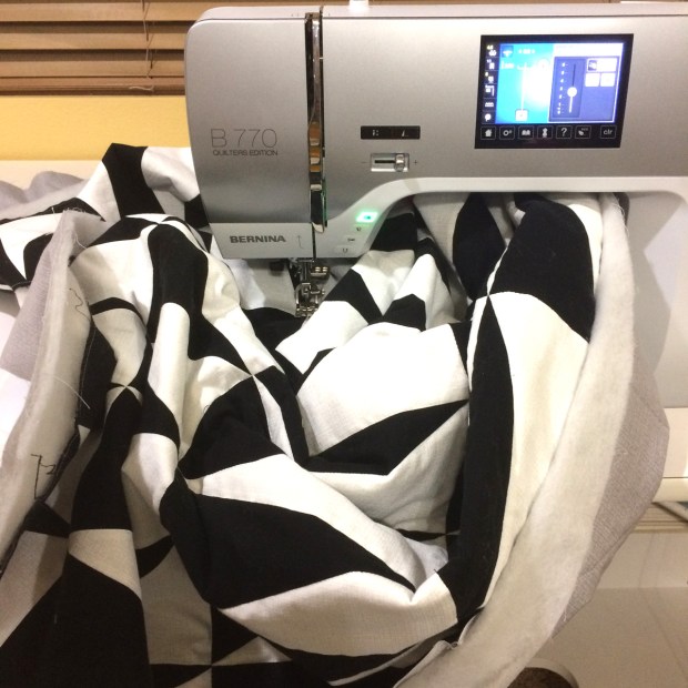 Managing the quilt bulk while machine quilting