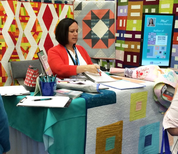 Christa at Quilt Market 2015