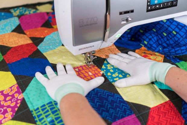 Use gloves to move the quilt