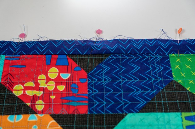 Pin the binding in place