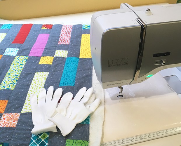 Tools for free motion quilting: open toe foot, gloves, supreme slider