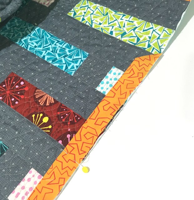 Attach binding to quilt