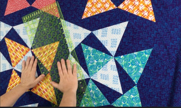 Spray Basting - smoothing the quilt