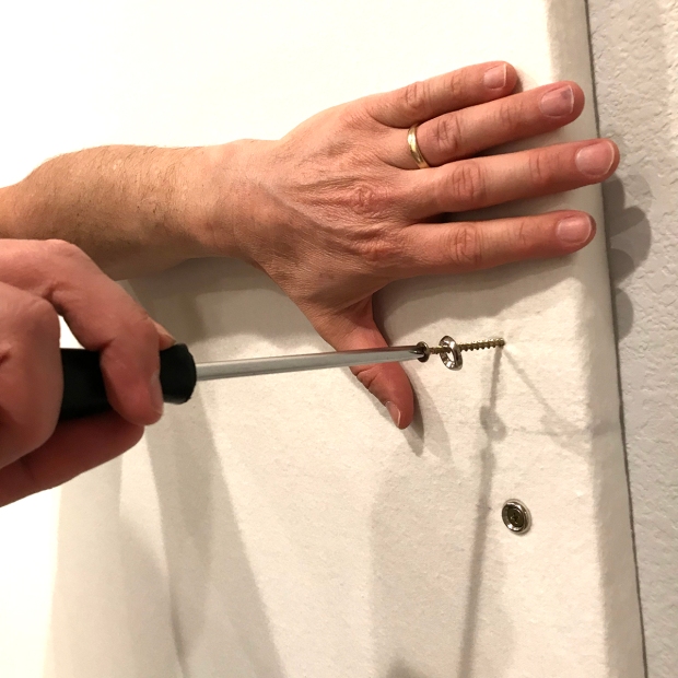 Attaching the screws in the design wall