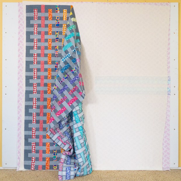 Adding the quilt top for basting